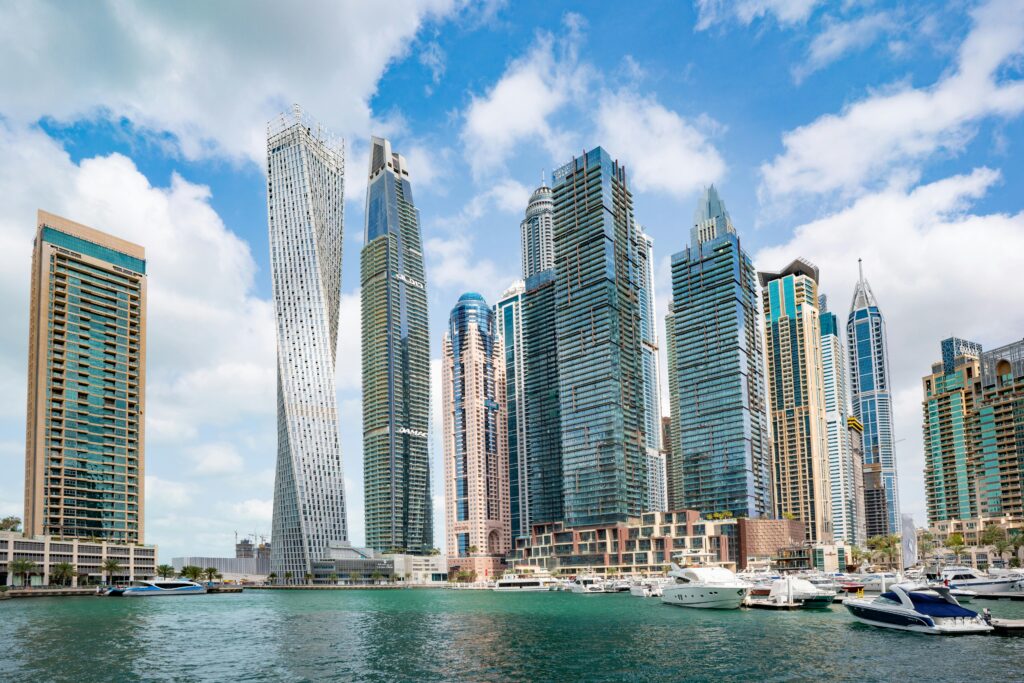Stunning view of Dubai Marina's iconic skyline with high-rise skyscrapers and calm waterfront.